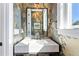 Stylish bathroom with floral wallpaper, modern fixtures, and marble countertop at 1903 S Cardenas Ave, Tampa, FL 33629
