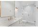 Beautiful bathroom featuring marble counters, gold finishes, and an enclosed glass shower at 1903 S Cardenas Ave, Tampa, FL 33629