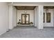 Stunning home entryway featuring double doors, elegant lighting, and decorative plants at 1903 S Cardenas Ave, Tampa, FL 33629