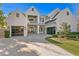 Beautiful two-story home featuring brick, two-car garages, and a manicured lawn with a paved driveway at 1903 S Cardenas Ave, Tampa, FL 33629