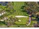Scenic aerial view of a manicured golf course with sand traps and water hazards, perfect for golf enthusiasts at 1903 S Cardenas Ave, Tampa, FL 33629