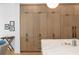 Gourmet kitchen featuring custom wood cabinets, a marble countertop, and modern black hardware at 1903 S Cardenas Ave, Tampa, FL 33629