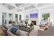 Comfortable living room with coffered ceilings, fireplace, hardwood floors and plenty of natural light at 1903 S Cardenas Ave, Tampa, FL 33629
