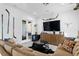 Inviting living room featuring comfortable seating, a media center, and modern decor at 1903 S Cardenas Ave, Tampa, FL 33629
