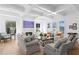 Bright living room with fireplace, beamed ceilings, and large windows at 1903 S Cardenas Ave, Tampa, FL 33629