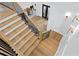 Elegant staircase with wooden treads and black iron railing at 1903 S Cardenas Ave, Tampa, FL 33629