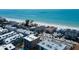 Aerial view of beachfront homes near the ocean with a sandy beach at 19925 Gulf Boulevard # 502, Indian Shores, FL 33785