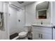 Clean bathroom with white tiled shower, sleek vanity, and modern black-trimmed mirror at 19925 Gulf Boulevard # 502, Indian Shores, FL 33785