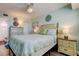 Comfortable bedroom with coordinated furnishings and ensuite bathroom at 19925 Gulf Boulevard # 502, Indian Shores, FL 33785