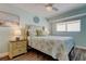 Cozy bedroom with serene colors and a beach-themed decorative accents at 19925 Gulf Boulevard # 502, Indian Shores, FL 33785