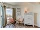 Cozy corner with rattan chairs, views and a white dresser at 19925 Gulf Boulevard # 502, Indian Shores, FL 33785