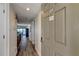 Hallway leading to the unit, featuring wood floors and an open view to the living area at 19925 Gulf Boulevard # 502, Indian Shores, FL 33785
