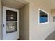 The 502 unit's front door is on a bright hallway at 19925 Gulf Boulevard # 502, Indian Shores, FL 33785