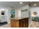 Kitchenette featuring granite countertops, wood cabinets, and access to the bath and bedroom at 19925 Gulf Boulevard # 502, Indian Shores, FL 33785