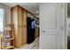Galley kitchen includes a black refrigerator, wooden cabinetry and microwave at 19925 Gulf Boulevard # 502, Indian Shores, FL 33785