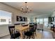 Bright, open living space with a sliding glass door to a balcony, complemented by stylish decor at 19925 Gulf Boulevard # 502, Indian Shores, FL 33785