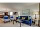 This open-concept living room has contemporary decor and blends seamlessly into the dining area at 19925 Gulf Boulevard # 502, Indian Shores, FL 33785