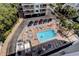 Community pool and hot tub surrounded by sun loungers for residents to enjoy at 19925 Gulf Boulevard # 502, Indian Shores, FL 33785