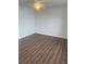 Empty bedroom featuring hard surface floors, ceiling fan, and white walls at 2007 W De Leon St # C, Tampa, FL 33606
