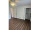 Bedroom with sleek wood floors and closet with custom shelving at 2007 W De Leon St # C, Tampa, FL 33606