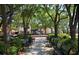 Scenic view of community park with benches, lush trees, and manicured landscaping at 2007 W De Leon St # C, Tampa, FL 33606