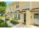 Charming two-story townhome with well-maintained landscaping and inviting front entrance at 2007 W De Leon St # C, Tampa, FL 33606