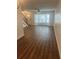 Spacious living room with hardwood floors and a large bay window providing ample natural light at 2007 W De Leon St # C, Tampa, FL 33606