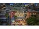 Aerial view showcasing the building exteriors, local restaurant, and cityscape at 215 Central Ave # 4F, St Petersburg, FL 33701