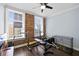 Bedroom with exposed brick wall, hardwood floors and street views at 215 Central Ave # 4F, St Petersburg, FL 33701