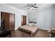 Open bedroom with ceiling fan, hardwood floors, and double closets at 215 Central Ave # 4F, St Petersburg, FL 33701