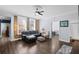 Inviting living room featuring exposed brick wall, ceiling fan, and hardwood floors at 215 Central Ave # 4F, St Petersburg, FL 33701
