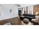 Inviting living room featuring exposed brick wall, ceiling fan, and hardwood floors at 215 Central Ave # 4F, St Petersburg, FL 33701