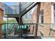 Spacious outdoor balcony with staircase access and views of neighboring buildings at 215 Central Ave # 4F, St Petersburg, FL 33701