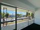The screened-in balcony has wrought iron details and an expansive view of the neighborhood at 2348 Shelley St # 13, Clearwater, FL 33765