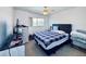 Comfortable bedroom features a window, dresser, TV, and ceiling fan, offering a cozy and practical space at 2348 Shelley St # 13, Clearwater, FL 33765