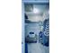 Walk in closet with shelf, rod, clothing, storage ottoman, and carpet offering functional storage solutions at 2348 Shelley St # 13, Clearwater, FL 33765