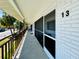 Building exterior showcasing a balcony with iron railings and well-kept facade, promoting a sense of charm at 2348 Shelley St # 13, Clearwater, FL 33765