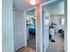 Bedroom access featuring a closet, neutral walls, and open doorway that highlights the functional layout at 2348 Shelley St # 13, Clearwater, FL 33765