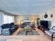 Comfortable living room with modern decor, wood floors and ample natural light at 2348 Shelley St # 13, Clearwater, FL 33765