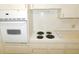 Bright kitchen features an electric range cooktop and a wall oven at 2449 Columbia Dr # 53, Clearwater, FL 33763