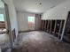 Bedroom featuring a bright window and a blank canvas ready for your personal touch and customization at 265 Corbett Rd, Lithia, FL 33547