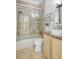 Bathroom featuring a shower-tub combination and a white vessel sink at 2863 Duncan Tree Cir, Valrico, FL 33594