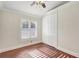 Bedroom with hardwood floors, ceiling fan, and double door closet at 2863 Duncan Tree Cir, Valrico, FL 33594