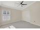 Comfortable bedroom with carpeted floor, ceiling fan and closet at 2863 Duncan Tree Cir, Valrico, FL 33594