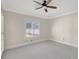 Bedroom featuring carpet floor, ceiling fan and a large window at 2863 Duncan Tree Cir, Valrico, FL 33594