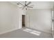 Bright bedroom with neutral carpet, white walls, and ceiling fan at 2863 Duncan Tree Cir, Valrico, FL 33594