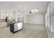Spacious open floor plan with modern kitchen island and abundant windows for natural light at 2863 Duncan Tree Cir, Valrico, FL 33594
