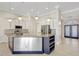 Stylish kitchen with stainless steel appliances, white cabinets, and a large center island at 2863 Duncan Tree Cir, Valrico, FL 33594