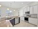 Well-appointed kitchen with stainless steel appliances, granite counters, and custom cabinetry at 2863 Duncan Tree Cir, Valrico, FL 33594