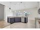 Bright kitchen boasts a large island, stainless steel appliances, and recessed lighting at 2863 Duncan Tree Cir, Valrico, FL 33594